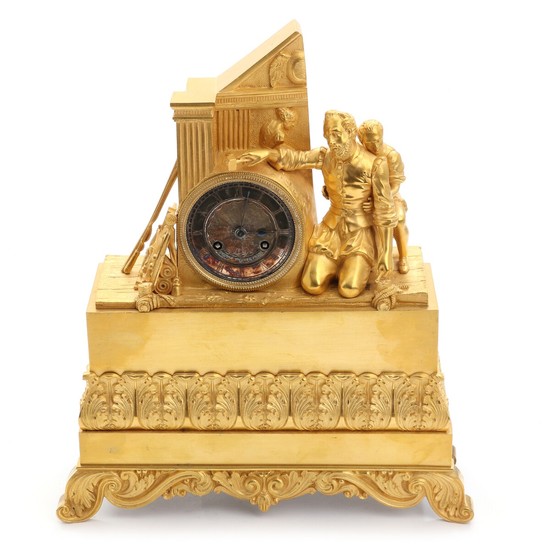 A French gilt bronze mantel clock, decorated with a sculpture and a boy, silvered dial with Roman numerals. Signed. 19th century. H. 36 cm.