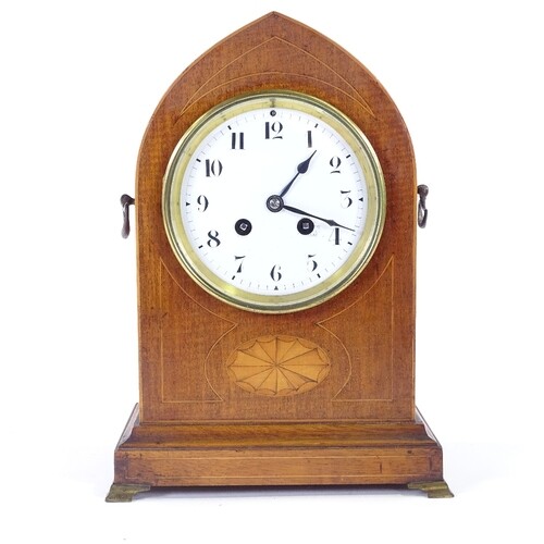 A French mahogany lancet-top 8-day mantel clock, satinwood i...