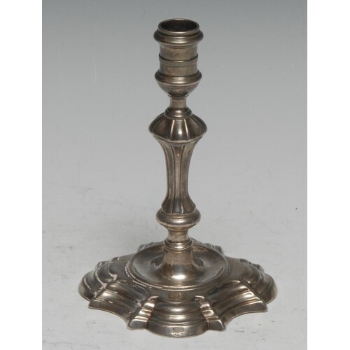A George II cast silver taper stick, knopped pillar, shaped ...