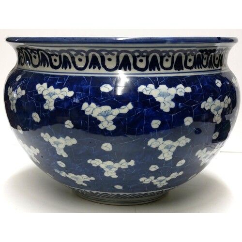A LARGE 19TH CENTURY CHINESE BOWL Decorated with prunus on ...