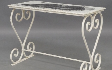 A Maltese tile top coffee table, c.1960, the rectangular monochrome tile top decorated with fish, on scrolling white painted and wrought iron end supports united by writhen stretcher, 46.5cm high, 63cm wide, 33cm deep