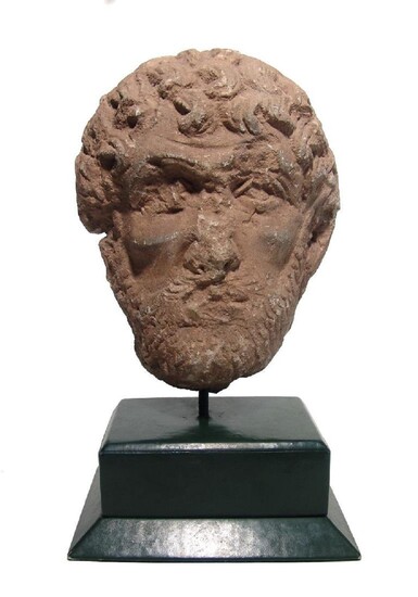 A Medieval limestone head of a bearded man