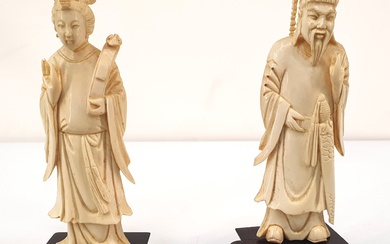 A PAIR OF EARLY 20TH CENTURY CHINESE CARVED IVORY EMPEROR AND EMPRESS FIGURINES