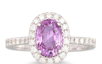 A PINK SAPPHIRE AND DIAMOND CLUSTER RING, the oval sapphire ...