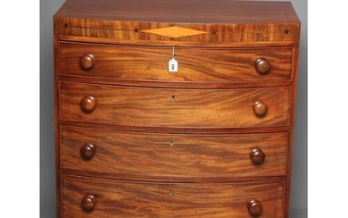 A REGENCY MAHOGANY BOW FRONT CHEST of four graduated drawers...