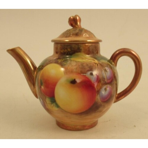 A Royal Worcester miniature tea pot, decorated with fruit by...