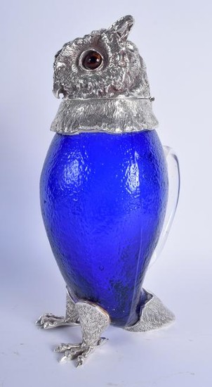 A SILVER PLATED CLARET JUG IN THE FORM OF AN OWL, inset