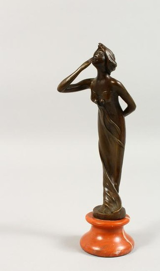 A SMALL ART NOUVEAU BRONZE OF A YOUNG LADY blowing a
