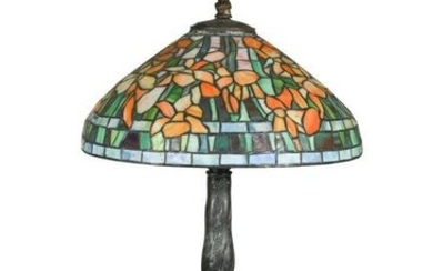 A Tiffany style leaded glass and bronze table lamp