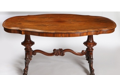 A Victorian Rosewood centre table, having a serpentine front...
