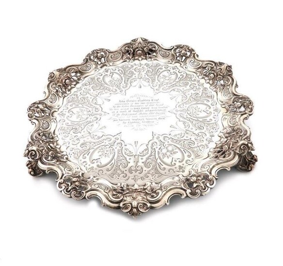 A Victorian presentation silver salver, by The Barnards, London 1852, circular form, pierced foliate scroll border, the centre with engraved decoration, and inscribed, ~Presented to John Bulmer Godfrey Esq. Commander of the Ship Statesman by the Cabin...