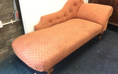 A Victorian style upholstered chaise longue with buttoned shaped back...