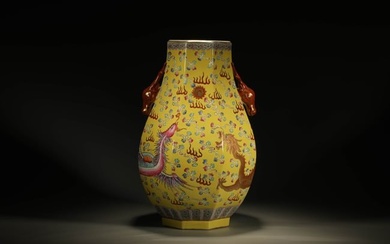 A YELLOW-GROUND FAMILLE ROSE DRAGON AND PHOENIX VASE