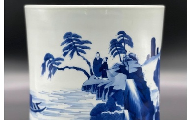 A blue and white brush pot with landscape and...