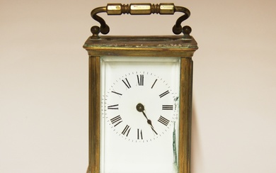 A brass carriage clock, H. 15cm.