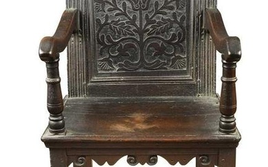 A carved oak open armchair, 17th century