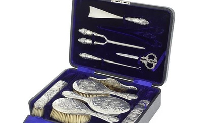A cased silver ten-piece silver dressing set brushes Chester 1902 / 1903, implements Birmingham ...