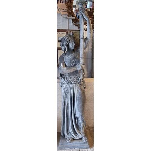 A contemporary Verdigris metal garden statue of a Grecian wo...