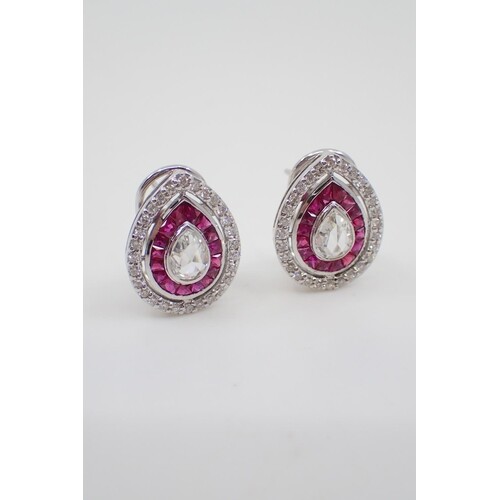 A diamond and ruby cluster earrings ring set in 18ct gold