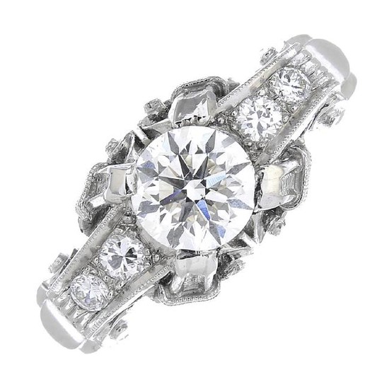 A diamond single-stone ring. Of openwork design, the