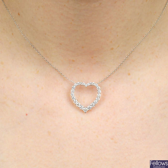 A graduated brilliant-cut diamond open heart pendant