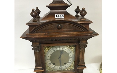A late 19th century walnut mantel clock with a silvered chap...
