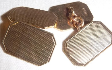 A pair of 9 carat gold engine turned cufflinks...