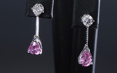 A pair of English pink sapphire and brilliant cut earrings of 18 kt. white gold, total approx. 1.26 ct. (2)