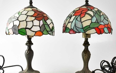 A pair of Tiffany-style leaded stain glass table lamps, on...