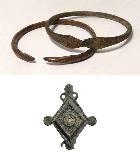 A pair of Western Asiatic bracelets and a Roman brooch
