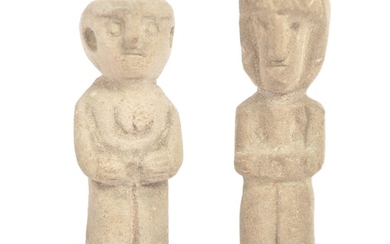 A pair of pre Columbian figures. To small stone carved figures, with flat topped head and naïve features, figures of column form. Approximately 10cm.