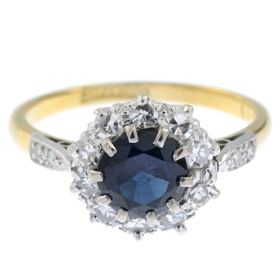 A sapphire and diamond cluster ring.Estimated total diamond...