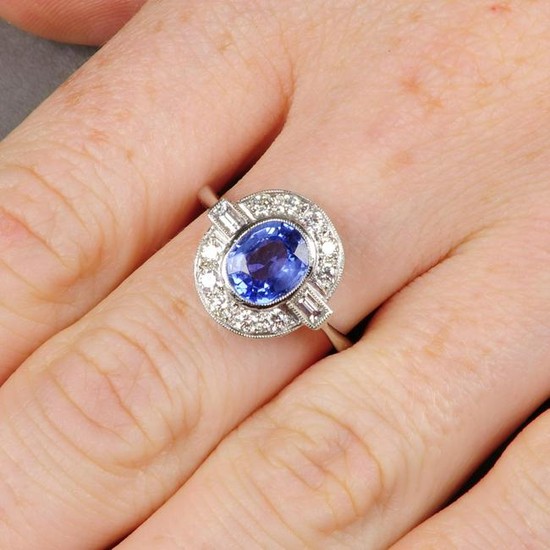 A sapphire and diamond dress ring.Sapphire calculated