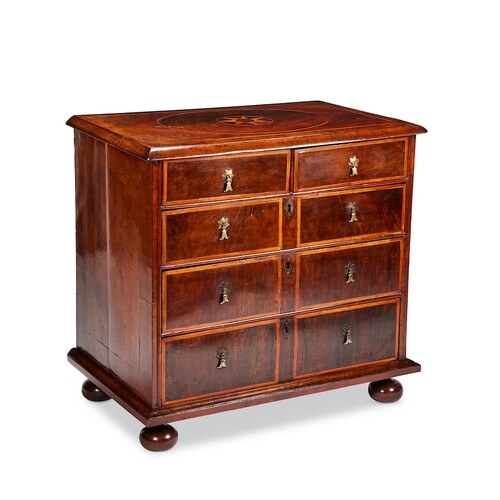 A small Queen Anne walnut and sycamore marquetry chest The r...