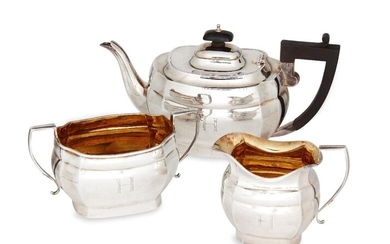 A three piece silver tea set, Birmingham, c.1927, Joseph Gloster, of shaped rectangular form with angular handles, the letters W and H engraved to the body of each, gilded interiors, total weight approx. 31.5oz (3)