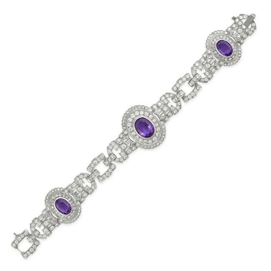 AN AMETHYST AND DIAMOND BRACELET, 1940s in platinum, set with three oval cut amethysts in double ...