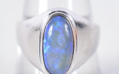 An 18 Carat White Gold Ring set with a Black Opal. Stamped ...