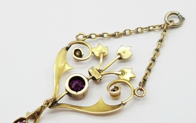 An Antique 9K Yellow Gold Amethyst and Seed Pearl Pendant. B...