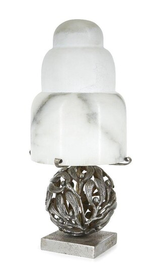 An Art Deco style silvered iron table lamp, in the manner of Edgar Brandt, late 20th century, modelled as a mistletoe ball, the square base bearing the signature EDGAR BRANDT, with mottled white alabaster shade, 26cm high Provenance: The Geoffrey...