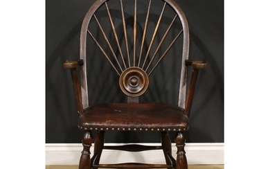 An Arts & Crafts period oak Windsor elbow chair, hoop back w...