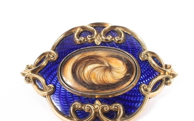 An enamel and yellow metal mourning brooch
