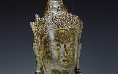 Buddha head, Thailand, 17th century, Khmer, his face with a...