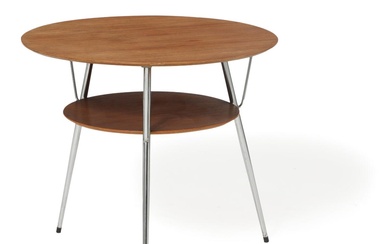 Danish furniture design A round teak coffee table with chromed steel legs....