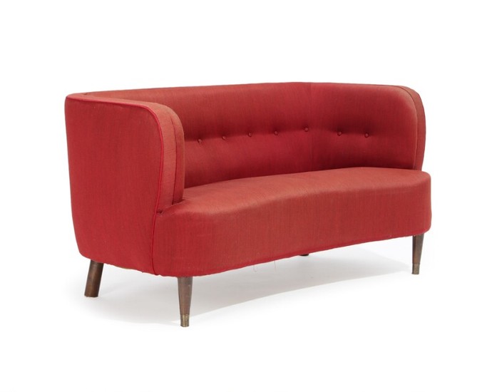 Danish furniture design: An organic shaped two-seater sofa upholstered with red wool, stained beech legs. 1940s. L. 143 cm.