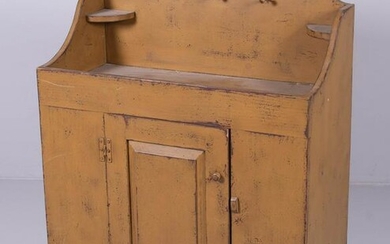 Distressed yellow painted dry sink
