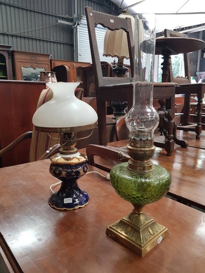 Edwardian Brass Kerosene Lamp & Electric Porcelain Lamp, the former with green glass font, the other with white glass shade