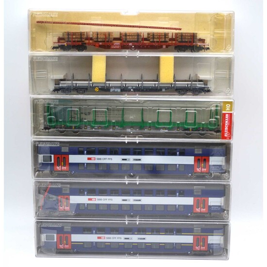 Fleischmann HO gauge model railways, coaches and log wagons.