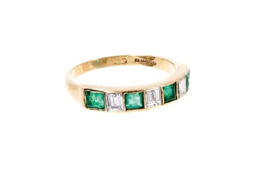 Gold diamond and emerald seven stone ring