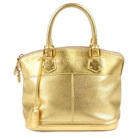 LOUIS VUITTON - a gold Suhali Lockit handbag. Crafted