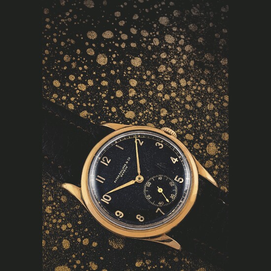 PATEK PHILIPPE. A RARE 14K GOLD WRISTWATCH WITH BLACK DIAL